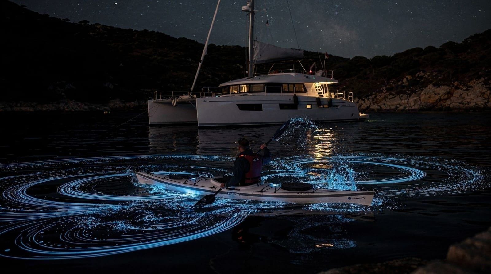Sea canoe glowing plankton catamaran