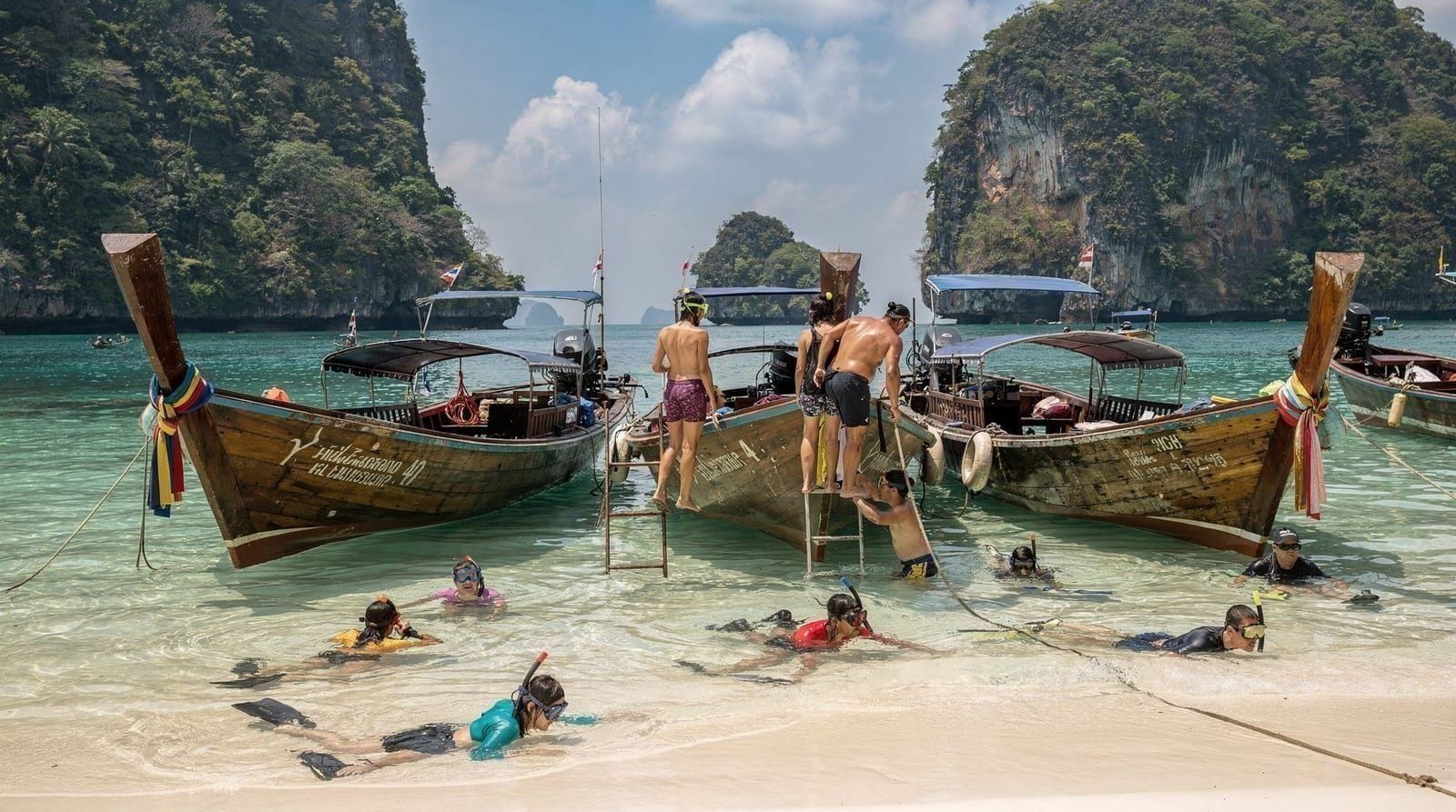 Krabi Tiger Cave, Emerald Pool and hot springs day tour — Climb 1,237 steps to a jungle summit, swim in a turquoise rainforest pool, and s